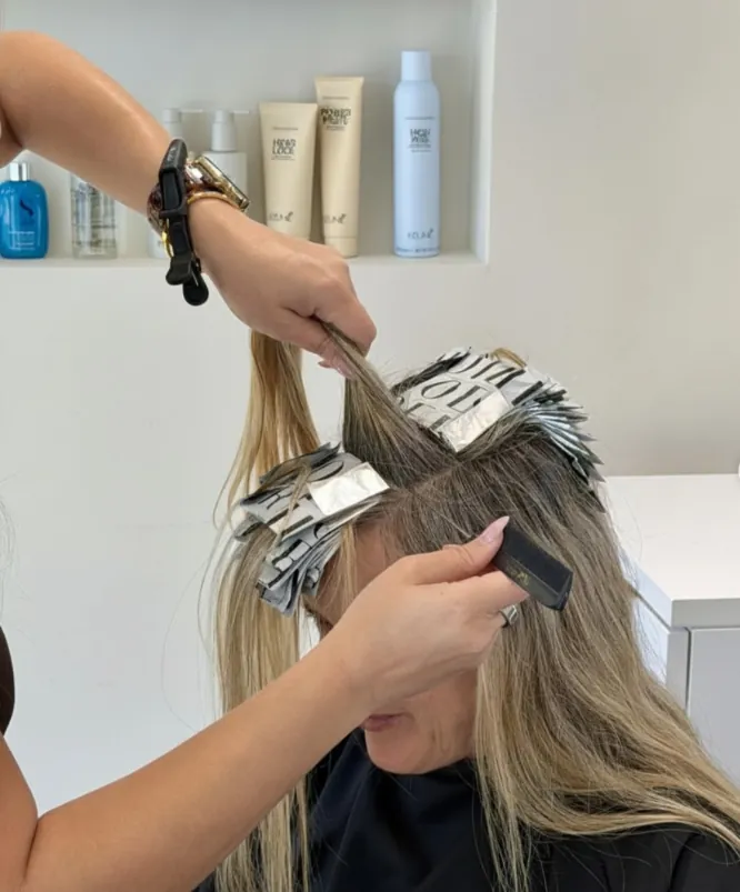 Foil highlights being placed with care